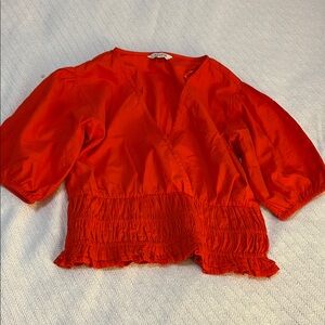 Chic Red Blouse with Ruffle Hem